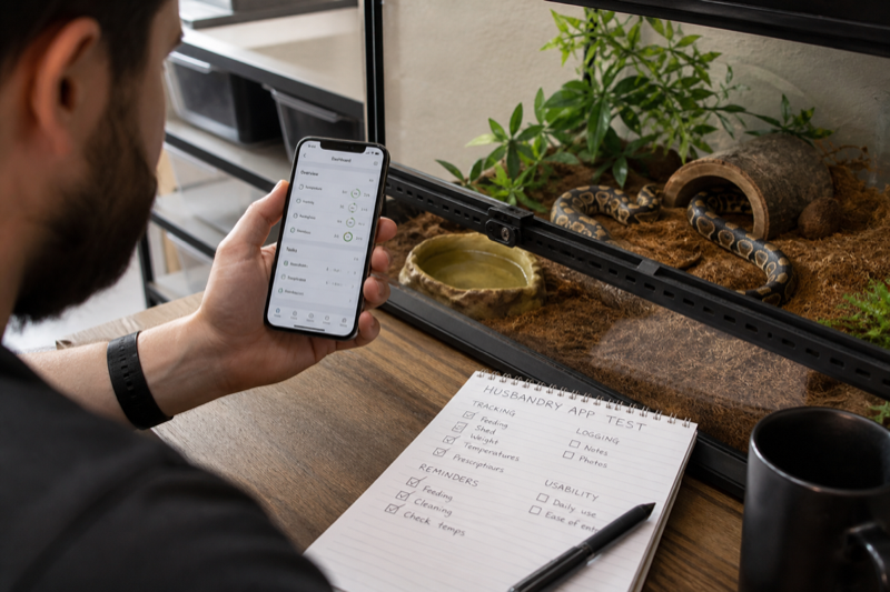 Independent test of a reptile husbandry app beside an enclosure